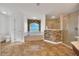 Bathroom features a soaking tub, stone accent wall and a glass enclosed shower at 6307 Se 8Th Ln, Ocala, FL 34472