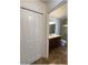 Bathroom featuring a single sink, vanity, and glass door shower with a clear door and tiled flooring at 6307 Se 8Th Ln, Ocala, FL 34472
