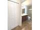 Bathroom featuring a vanity, toilet, and a glass-enclosed shower, with modern fixtures at 6307 Se 8Th Ln, Ocala, FL 34472