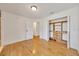 Bedroom features hardwood floors and a walk-in closet with custom built-ins at 6307 Se 8Th Ln, Ocala, FL 34472