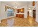 Dining room featuring custom cabinets, a chandelier, and a large window at 6307 Se 8Th Ln, Ocala, FL 34472