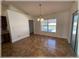 Dining area with sliding glass doors providing access to the lanai and a view of the pool at 6307 Se 8Th Ln, Ocala, FL 34472