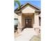Inviting home entrance featuring double doors, stone accents, manicured landscaping, and decorative lighting at 6307 Se 8Th Ln, Ocala, FL 34472