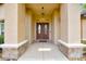 Close-up view of the inviting front door with sidelights, stone accents and overhead light fixture at 6307 Se 8Th Ln, Ocala, FL 34472