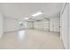 Spacious two-car garage features clean epoxy floors and ample space for parking and storage at 6307 Se 8Th Ln, Ocala, FL 34472