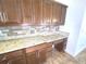 Kitchen counter space with cabinets, drawers, and stone tile backsplash at 6307 Se 8Th Ln, Ocala, FL 34472