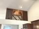 A built-in wine rack above kitchen cabinets at 6307 Se 8Th Ln, Ocala, FL 34472