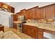 Well-equipped kitchen features stainless steel appliances, granite counters, and stylish backsplash at 6307 Se 8Th Ln, Ocala, FL 34472