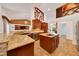Open kitchen with granite counters, a central island, and a view of living area at 6307 Se 8Th Ln, Ocala, FL 34472