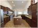 Updated kitchen with stainless steel appliances, granite countertops and central island at 6307 Se 8Th Ln, Ocala, FL 34472
