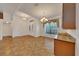 Open living room featuring tile flooring, ample natural light, and a stylish chandelier at 6307 Se 8Th Ln, Ocala, FL 34472