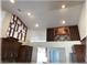 Living room featuring two decorative wine racks and vaulted ceilings at 6307 Se 8Th Ln, Ocala, FL 34472