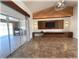Open living room featuring modern decor, a decorative ceiling accent, and access to the patio at 6307 Se 8Th Ln, Ocala, FL 34472