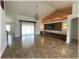 Open living room featuring modern decor, a decorative ceiling accent, and sliding glass doors at 6307 Se 8Th Ln, Ocala, FL 34472