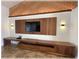 The Living room boasts a feature wall with rich wood finishes and ambient lighting at 6307 Se 8Th Ln, Ocala, FL 34472