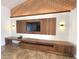 Modern living room with custom wood entertainment center and geometric wall decor at 6307 Se 8Th Ln, Ocala, FL 34472