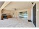 Covered patio with an outdoor kitchen, tile flooring, ceiling fan, and sliding glass doors at 6307 Se 8Th Ln, Ocala, FL 34472