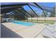 Enjoy this screened pool with a sunny pool deck, slide, and lounge chairs for entertaining at 6307 Se 8Th Ln, Ocala, FL 34472