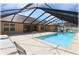 Relax by the screened pool with slide, spacious deck, and lounge chairs in a private backyard at 6307 Se 8Th Ln, Ocala, FL 34472