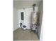 This home offers a utility room with a water heater, electric panel, and ample space at 6307 Se 8Th Ln, Ocala, FL 34472