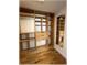 Custom walk-in closet featuring wooden shelves, drawers, and a hanging rod providing ample storage space at 6307 Se 8Th Ln, Ocala, FL 34472