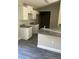 Bright kitchen featuring stylish cabinets, gray counter tops and new stainless steel appliances at 734 Nw 57Th Ave, Ocala, FL 34482