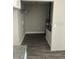 Spacious pantry area with gray wood flooring, white shelving, and utility connections at 734 Nw 57Th Ave, Ocala, FL 34482
