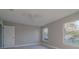 Bright bedroom with neutral paint, ample windows, ceiling fan, and tile flooring at 75 Pine Crse, Ocala, FL 34472
