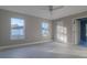 Bedroom featuring bright windows, neutral paint, and modern tile flooring at 75 Pine Crse, Ocala, FL 34472