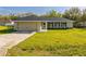 Beautiful single-story home featuring a manicured lawn and an attached garage at 75 Pine Crse, Ocala, FL 34472