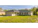 Charming single-story home featuring a well-manicured lawn and an attached garage at 75 Pine Crse, Ocala, FL 34472
