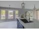 Bright kitchen with a large island, modern fixtures, and plenty of natural light, great for entertaining at 75 Pine Crse, Ocala, FL 34472