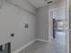 Spacious laundry room with tile floors and shelving at 75 Pine Crse, Ocala, FL 34472