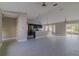Spacious open-concept living area with tile floors, recessed lighting, and sliding glass door to the backyard at 75 Pine Crse, Ocala, FL 34472