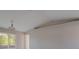 Bright living area with vaulted ceilings and a sliding glass door to the backyard at 75 Pine Crse, Ocala, FL 34472