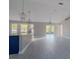 Open-concept living area featuring tile flooring, modern lighting, and seamless flow into the kitchen at 75 Pine Crse, Ocala, FL 34472