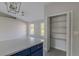 Walk-in pantry with built-in shelving, providing ample storage space off of the kitchen area at 75 Pine Crse, Ocala, FL 34472