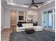 Open-concept living room with hardwood floors, modern furniture and plenty of natural light at 7635 Nw 33Rd Pl, Ocala, FL 34482
