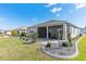 A screened-in lanai and paver patio enhance this home's beautifully landscaped backyard at 7698 Sw 85Th Cir, Ocala, FL 34481