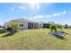 The screened-in lanai and mature landscaping in this backyard create an ideal outdoor space at 7698 Sw 85Th Cir, Ocala, FL 34481