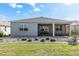 A screen-enclosed lanai with a brick paver patio provides outdoor relaxation in the private backyard at 7698 Sw 85Th Cir, Ocala, FL 34481