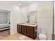 Bathroom with a double sink vanity, toilet, and walk-in shower at 7698 Sw 85Th Cir, Ocala, FL 34481