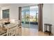 Dining area with tile floors adjacent to a sliding glass door providing access to the screened-in lanai at 7698 Sw 85Th Cir, Ocala, FL 34481