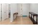 Bright foyer with tile floor, decorative console tables, and a view into the bedroom at 7698 Sw 85Th Cir, Ocala, FL 34481