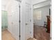 Hallway leading to a bedroom and bathroom with linen closet at 7698 Sw 85Th Cir, Ocala, FL 34481