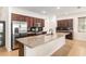 Modern kitchen offers granite countertops, dark wood cabinets, and state-of-the-art appliances at 7698 Sw 85Th Cir, Ocala, FL 34481