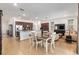 An expansive and flowing living space with an adjacent open-concept kitchen and dining area at 7698 Sw 85Th Cir, Ocala, FL 34481