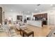 Spacious living area with an open floor plan that connects seamlessly to the dining and kitchen spaces at 7698 Sw 85Th Cir, Ocala, FL 34481