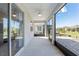 A screened patio providing seamless indoor-outdoor living with views of the well-maintained backyard landscaping at 7698 Sw 85Th Cir, Ocala, FL 34481