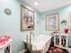 Well-lit bathroom features a soaking tub, and decorative cabinets with floral accents at 7955 Sw 62Nd Ct, Ocala, FL 34476